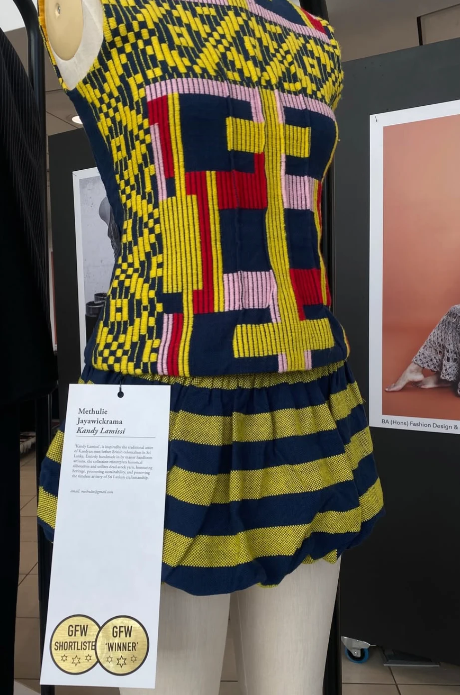 Handwoven Kandy Lamissi garment on a mannequin at the exhibition